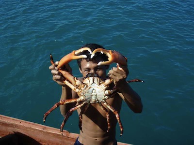 A Kuna Fisherman Offers a Crab in Exchange for a Gallon of Gas 